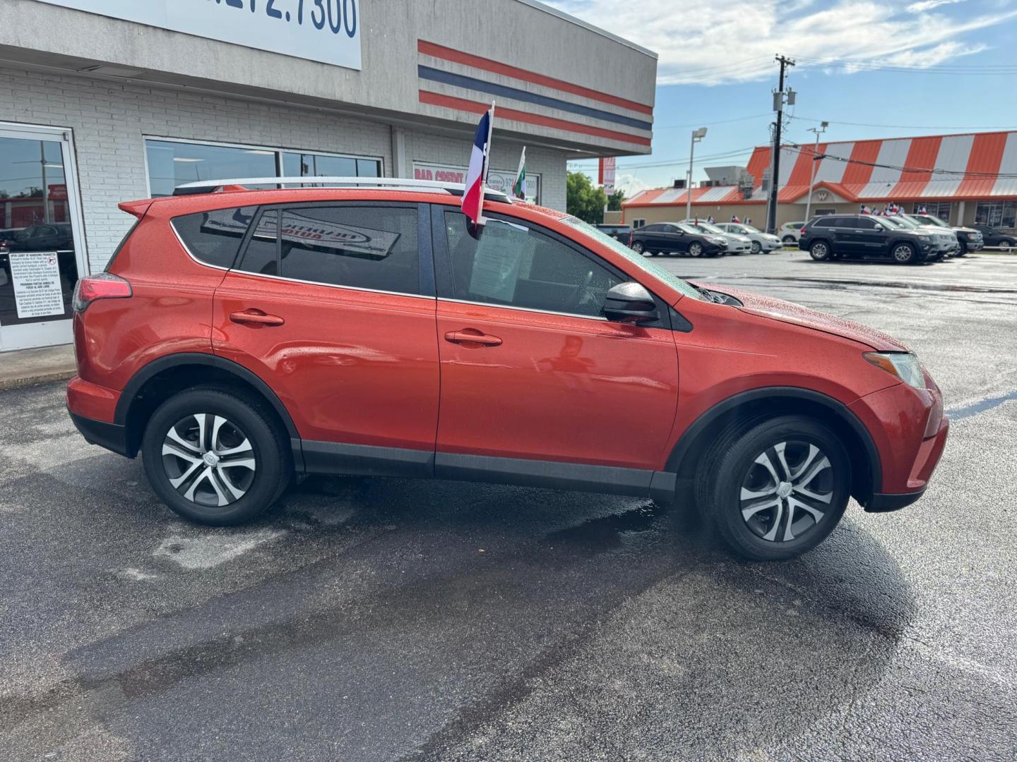2016 ORANGE TOYOTA RAV4 LE (2T3ZFREVXGW) , located at 10740 Forest Lane, Dallas, TX, 75243, (972) 272-7300, 32.908588, -96.701813 - Photo#2