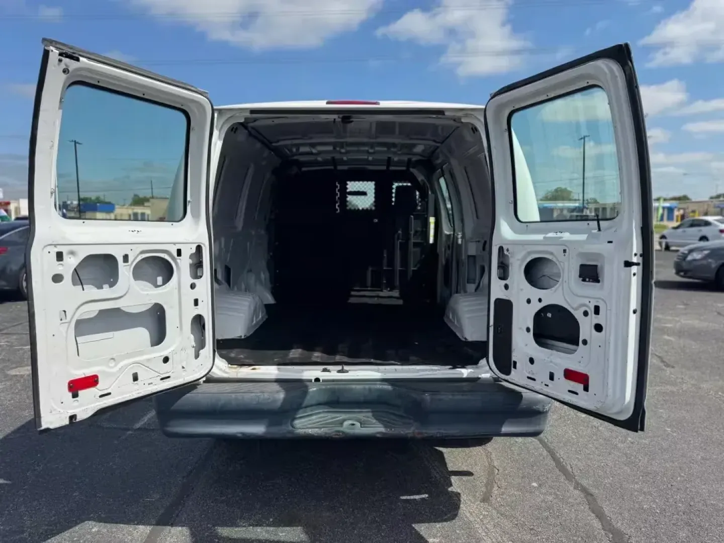 2012 WHITE Ford E-Series Van E-150 (1FTNE1EW9CD) with an 4.6L V8 SOHC 16V engine, 4-Speed Automatic transmission, located at 10740 Forest Lane, Dallas, TX, 75243, (972) 272-7300, 32.908588, -96.701813 - Are you a business owner in need of a reliable workhorse, or perhaps a weekend adventurer seeking the perfect cargo van for your next trip? Look no further than this 2012 Ford E-Series Van, available now at Traditional Autos, your trusted pre-owned dealership located at 10740 Forest Lane, Dallas, TX - Photo#13