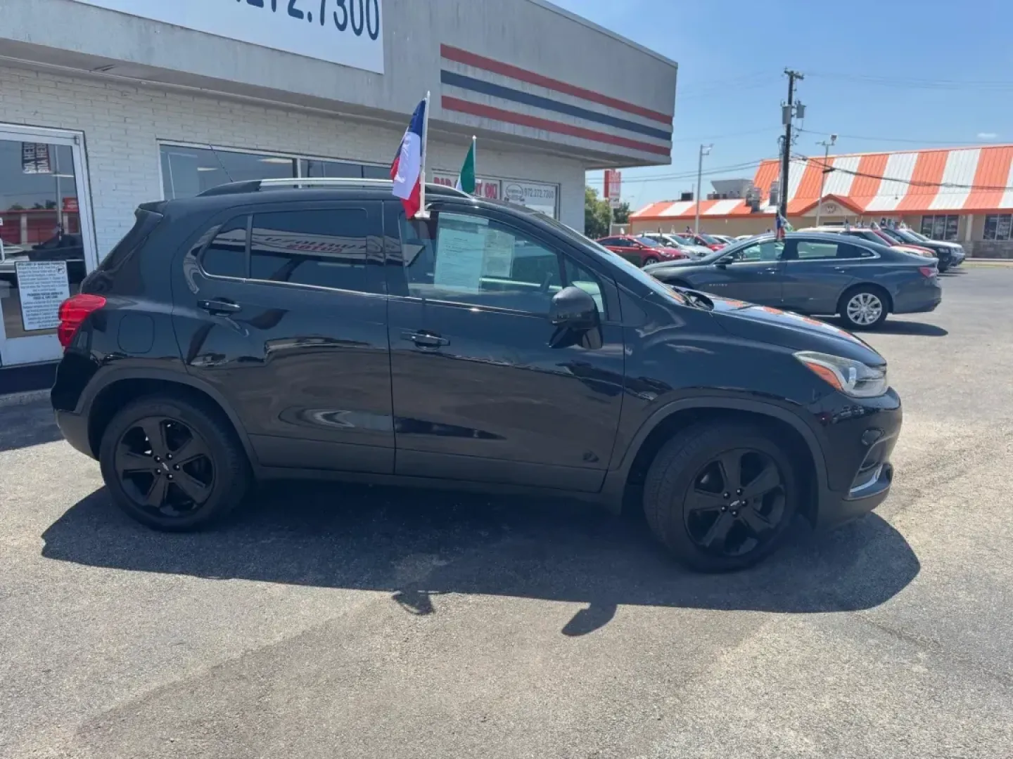 2017 BLACK Chevrolet Trax Premier FWD (KL7CJMSB3HB) with an 1.4L L4 DOHC 16V engine, 6A transmission, located at 10740 Forest Lane, Dallas, TX, 75243, (972) 272-7300, 32.908588, -96.701813 - 2017 Chevrolet Trax Premier FWD - Photo#2