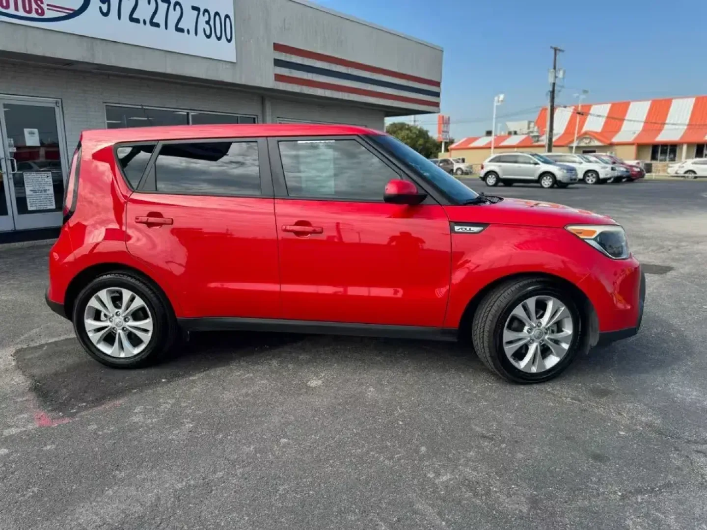 2015 RED Kia Soul + (KNDJP3A57F7) with an 2.0L L4 DOHC 16V engine, 6-Speed Automatic transmission, located at 10740 Forest Lane, Dallas, TX, 75243, (972) 272-7300, 32.908588, -96.701813 - Are you searching for a versatile vehicle that can keep up with your dynamic lifestyle? Look no further than this 2015 Kia Soul, a compact wagon perfect for everything from daily commutes to weekend getaways. With its spacious interior and excellent fuel efficiency, this vehicle truly embodies the s - Photo#3