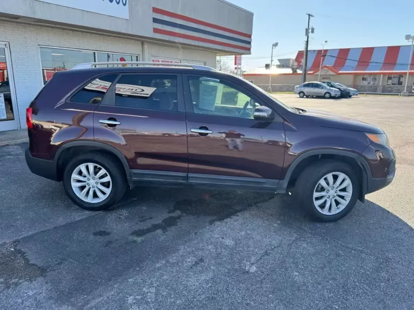 2011 MAROON Kia Sorento LX 2WD (5XYKT4A23BG) with an 3.5L V6 DOHC 24V engine, 6-Speed Automatic transmission, located at 10740 Forest Lane, Dallas, TX, 75243, (972) 272-7300, 32.908588, -96.701813 - Are you searching for a reliable, family-friendly SUV that fits seamlessly into your active lifestyle? Look no further than this 2011 Kia Sorento LX, now available at Traditional Autos in Dallas, TX. This remarkable pre-owned vehicle combines practicality, comfort, and style, making it the ideal cho - Photo#3