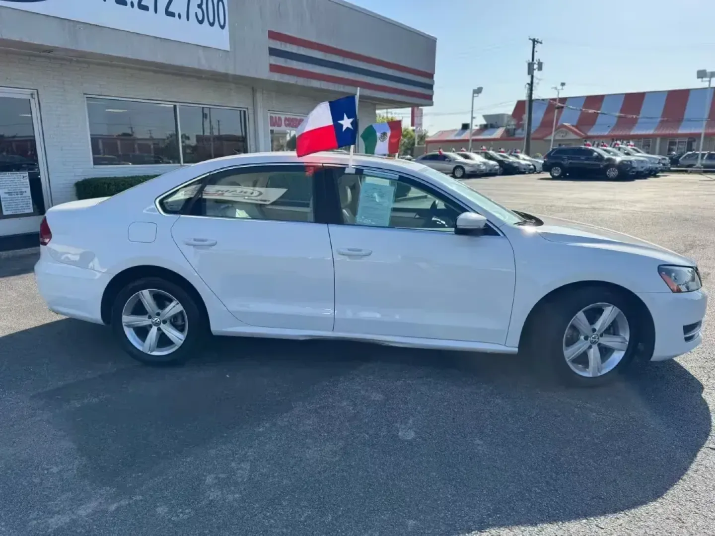 2013 WHITE Volkswagen Passat 2.5L SE MT (1VWBH7A3XDC) with an 2.5L L5 DOHC 2OV engine, 6-Speed Automatic transmission, located at 10740 Forest Lane, Dallas, TX, 75243, (972) 272-7300, 32.908588, -96.701813 - **Discover Adventure and Comfort in the 2013 Volkswagen Passat at Traditional Autos!**<br /> <br /> Are you ready to elevate your commuting experience or embark on a weekend adventure? Look no further than the 2013 Volkswagen Passat, a versatile sedan that perfectly balances comfort, efficiency, and - Photo#2