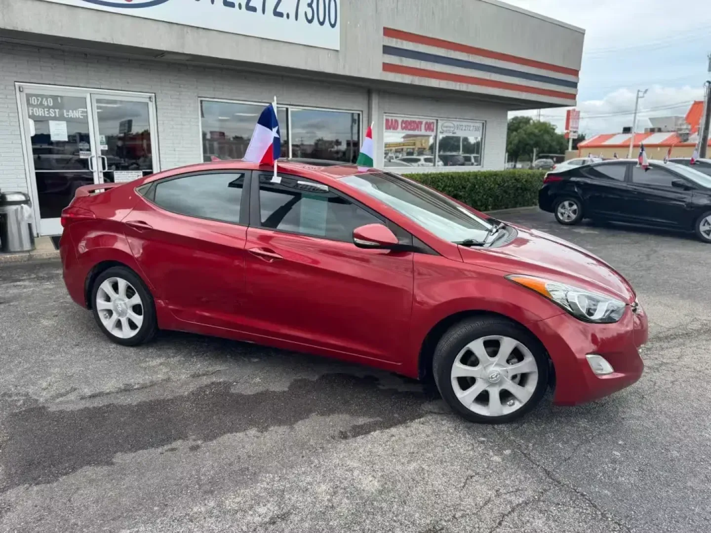 2013 RED Hyundai Elantra GLS A/T (KMHDH4AE6DU) with an 1.8L L4 DOHC 16V engine, 6-Speed Automatic transmission, located at 10740 Forest Lane, Dallas, TX, 75243, (972) 272-7300, 32.908588, -96.701813 - Discover the perfect blend of style, efficiency, and affordability with this stunning 2013 Hyundai Elantra GLS A/T, available now at Traditional Autos, your trusted pre-owned vehicle dealer in Dallas, TX. Whether you're a commuter looking to save on gas or a growing family seeking a reliable and spa - Photo#1