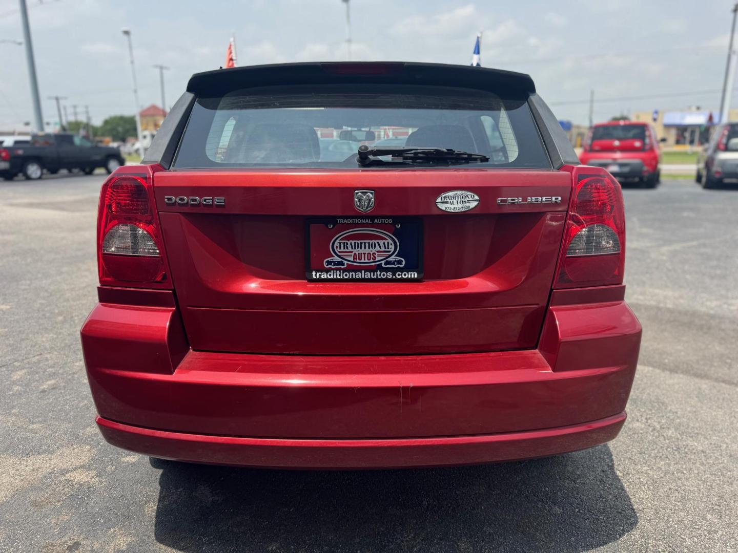 2010 ORANGE DODGE CALIBER UPTOWN Uptown (1B3CB9HB9AD) with an 2.4L L4 DOHC 16V engine, Continuously Variable Transmisson transmission, located at 10740 Forest Lane, Dallas, TX, 75243, (972) 272-7300, 32.908588, -96.701813 - Photo#2